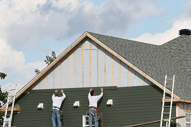 Professional Siding technician working in Boston, MA